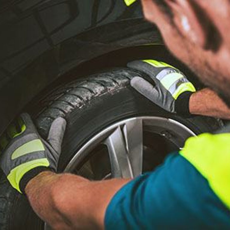 Tire and Wheel Service. Men Preparing Equipment For a Tire Service.
