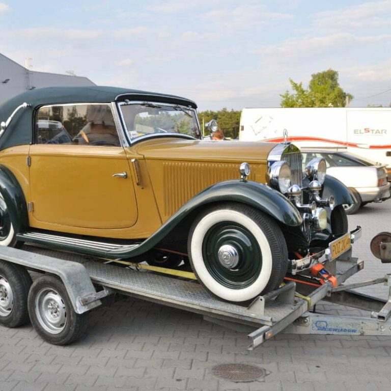 vintage vehicle getting towed